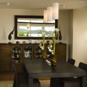 In this kitchen remodel, the designer painted the dining room, furniture, interior design, room, table, brown, black