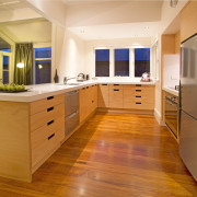 Toni Roberts kitchen with Fisher &amp; Paykel appliances cabinetry, countertop, cuisine classique, floor, flooring, hardwood, interior design, kitchen, real estate, room, wood, wood flooring, orange, brown