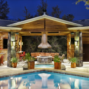 Facilities at this well-equipped pool pavillion include a backyard, estate, home, leisure, lighting, outdoor structure, patio, property, real estate, resort, swimming pool, villa, brown