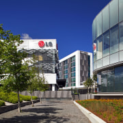 The Crossing at Highbrook Business Park was constructed architecture, building, campus, city, commercial building, condominium, corporate headquarters, daytime, facade, headquarters, metropolitan area, mixed use, neighbourhood, real estate, residential area, sky, urban design, blue