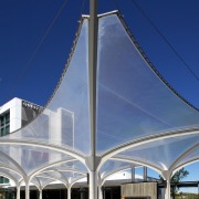 The soaring roof of the Kauwi Interpretive Centre architecture, building, facade, sky, structure, blue