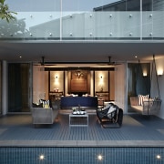 Large doors open up the living area to estate, home, house, interior design, real estate, gray, black