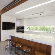 A long, low window in this kitchen looks architecture, cabinetry, countertop, house, interior design, kitchen, property, real estate, gray