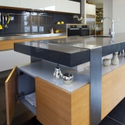 This kitchen designed by Melanie Craig Design features countertop, floor, furniture, interior design, kitchen, product design, table, black