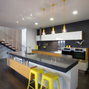 Side-by-side ovens are elevated for easy accessibility in architecture, furniture, interior design, product design, table, gray, black