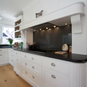 The hob area is the centrepiece of the cabinetry, countertop, cuisine classique, home, home appliance, interior design, kitchen, room, gray