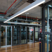 Zig-zag lighting by Aesthetics LIghting was custom designed building, glass, structure, black, gray