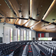 The new 1500-seat auditorium can accommodate all puplis auditorium, conference hall, convention center, performing arts center, brown, gray, black