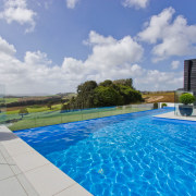 Infinity pool for country house by Mayfair Pools. estate, home, house, leisure, property, real estate, resort, sky, swimming pool, villa, water, gray
