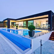 Infinity pool for country house by Mayfair Pools. apartment, architecture, estate, home, house, leisure, property, real estate, resort, swimming pool, villa, teal