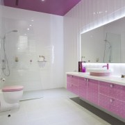 Pink features in this girls bathroom  in bathroom, floor, interior design, pink, product design, purple, room, gray