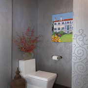 Geometric themes play a unifying role in the bathroom, ceiling, ceramic, floor, home, interior design, plumbing fixture, product design, room, tile, toilet, wall, gray