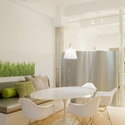 The Eames-style dining chairs and table in this ceiling, chair, floor, furniture, home, house, interior design, interior designer, living room, product design, table, wall, gray