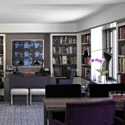 The darker den area in this remodeled apartment bookcase, furniture, home, interior design, living room, purple, room, shelving, black, gray