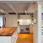 To make use of space in this kitchen, cabinetry, ceiling, countertop, cuisine classique, floor, flooring, hardwood, interior design, kitchen, real estate, room, wood, wood flooring, gray