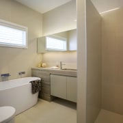 This guest bathroom was transformed by designer Celia architecture, bathroom, daylighting, floor, home, interior design, property, real estate, room, gray, brown