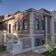 In this remodel by architect William Massey, the building, cottage, elevation, estate, facade, historic house, home, house, mansion, property, real estate, residential area, gray