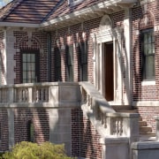 Entry to classic house with modern insertions - architecture, brick, building, facade, historic house, home, house, landmark, mansion, neighbourhood, outdoor structure, real estate, residential area, roof, structure, window, gray