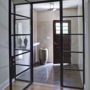 As part of a comprehensive remodel of a door, floor, flooring, glass, hardwood, interior design, window, gray