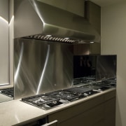 Sleek, contemporary German kitchen - Sleek, contemporary German cabinetry, countertop, home appliance, interior design, kitchen, kitchen stove, major appliance, room, under cabinet lighting, brown