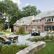 An extensive remodeling project has transformed this 1920s backyard, cottage, courtyard, estate, farmhouse, garden, home, house, landscape, landscaping, outdoor structure, property, real estate, yard