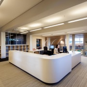 Reception area in the new mixed-media library facility ceiling, floor, flooring, institution, interior design, lobby, office, gray, brown