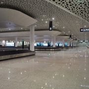 The check-in islands, gates and passport-check area all airport, airport terminal, architecture, building, daylighting, infrastructure, metropolitan area, gray