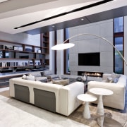 The double-height living room in this new home interior design, living room, white, gray