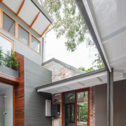 Here, a brick facade of the original dwelling architecture, courtyard, daylighting, estate, facade, home, house, real estate, residential area, roof, siding, window, gray, white