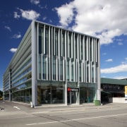 Large louvres and fins shield the new Young architecture, building, commercial building, condominium, corporate headquarters, facade, headquarters, metropolitan area, mixed use, real estate, sky, gray, blue