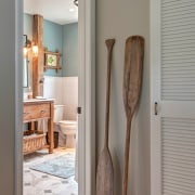 This modest guest bathroom celebrates a relaxed seaside door, floor, flooring, home, interior design, room, wall, wood, gray