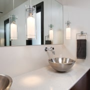 Taking a cue from contemporary luxury hotels, this bathroom, bathroom sink, countertop, floor, interior design, product design, sink, tap, gray