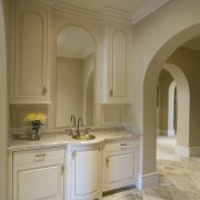 Arched openings lead through to suite to the bathroom, bathroom cabinet, cabinetry, ceiling, countertop, cuisine classique, estate, floor, flooring, home, interior design, kitchen, room, sink, wall, brown, gray