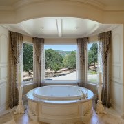 An MTI Whirlpools tub sits in front of bathroom, bathtub, estate, home, interior design, real estate, room, window, brown, gray