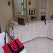 Before remodeling, this bathroom featured fully fitted cabinets cabinetry, countertop, floor, flooring, furniture, home, house, kitchen, property, room, gray