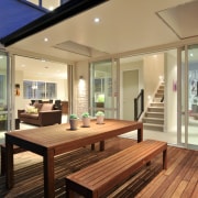 Outdoor living areas are a key part of hardwood, house, interior design, property, real estate, window, wood, brown, orange