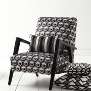 In modern commercial interiors, an eye-catching furnishing scheme black, black and white, chair, couch, cushion, furniture, loveseat, product, product design, sofa bed, white