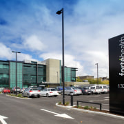 quantity surveyors Rawlinsons came on board for the architecture, building, city, corporate headquarters, infrastructure, metropolitan area, mixed use, parking lot, road, sky, white, teal