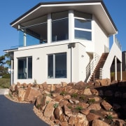 Contemporary family home by Graeme Alexander Homes architecture, building, cottage, elevation, facade, home, house, property, real estate, residential area, siding, sky, window, blue, black