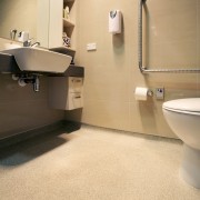 Durable, safe, anti-slip flooring for bathrooms in the bathroom, floor, flooring, interior design, plumbing fixture, product design, room, sink, tap, tile, orange