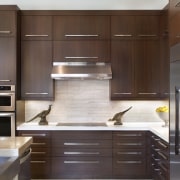 The splashback in this remodelled kitchen features light-toned cabinetry, countertop, cuisine classique, furniture, hardwood, interior design, kitchen, room, wood, brown, gray