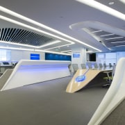 This high-tech office features workstations that were custom architecture, product design, gray