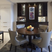This custom walnut display cabinet is balanced by dining room, furniture, interior design, room, table, gray, black