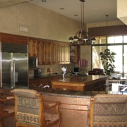 Dated wood cabinets and a brown colour scheme countertop, interior design, kitchen, living room, real estate, room, brown