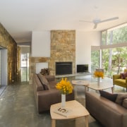 The east-west axis of this house is defined ceiling, house, interior design, living room, real estate, room, gray, brown