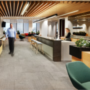 The large stairway void, centrally located hubs and floor, flooring, hardwood, interior design, laminate flooring, lobby, wood, wood flooring, gray