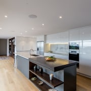 This kitchen by designer Sue Gillbanks CKDNZ, of architecture, countertop, interior design, kitchen, real estate, room, gray