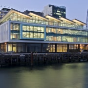 The Meridian building, the first certified Green Star architecture, building, canal, city, cityscape, condominium, corporate headquarters, downtown, evening, facade, metropolis, metropolitan area, mixed use, real estate, reflection, skyscraper, water, water transportation, waterway, black