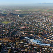 The town of Lens in northern France has aerial photography, atmosphere of earth, bird's eye view, city, cityscape, metropolis, metropolitan area, photography, residential area, sky, suburb, urban area, urban design, gray, black