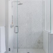 The shower in this white bathroom is lined angle, bathroom, glass, plumbing fixture, shower, shower door, gray